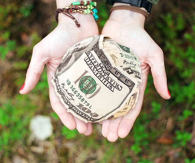Woman's hands holding cash