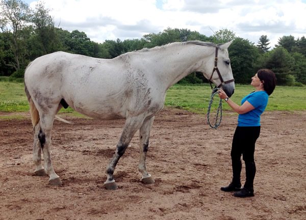 Cheryl and Leo Standing in Wet Dirt after Leo has Rolled Around
