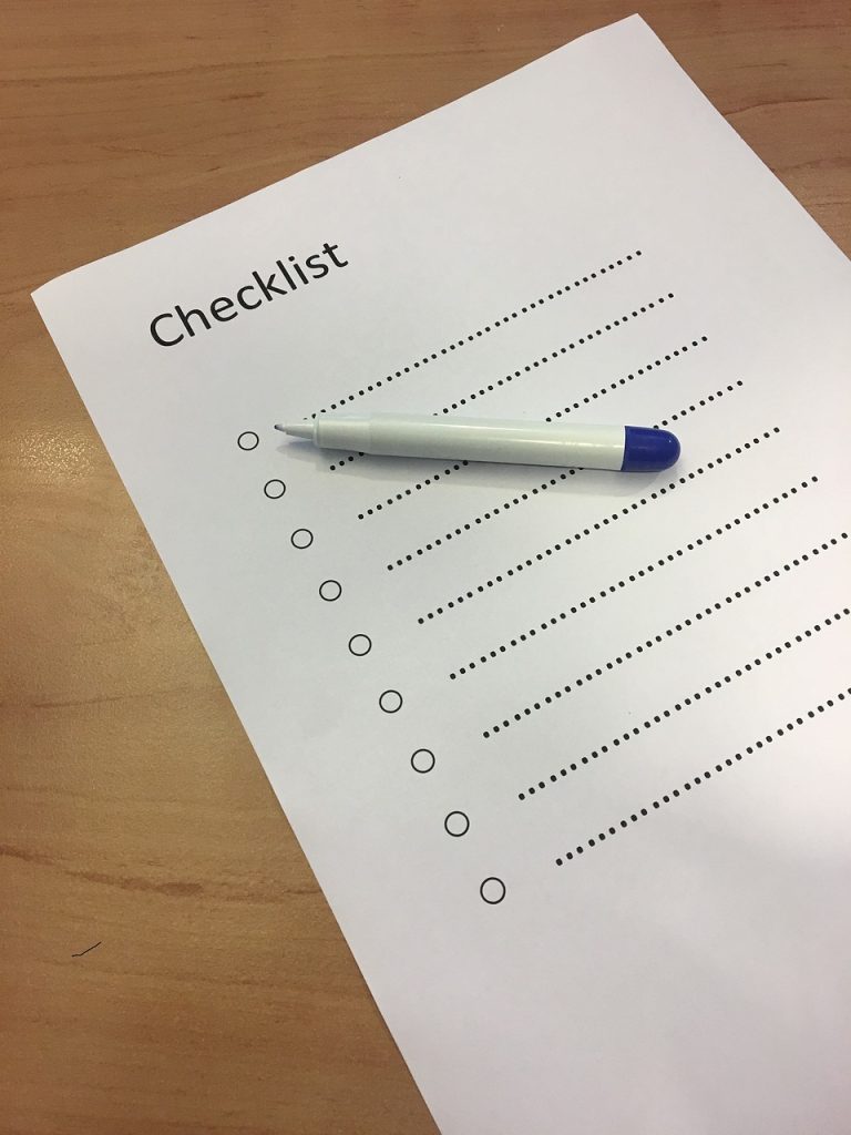 Close-up of a checklist template with a pen